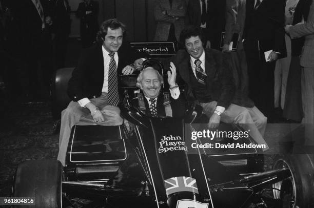 Colin Chapman , chairman of the Lotus group and manager of Team Lotus, unveils the John Player Special Mark III, the team's Formula 1 challenger for...