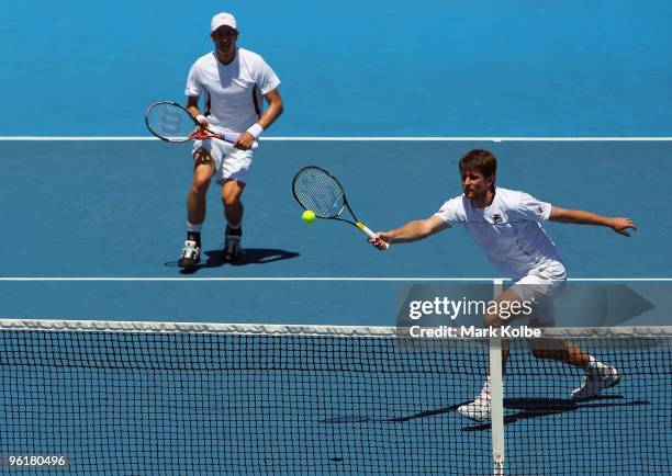 Michael Kohlmann of Germany plays a forehand in his fourth round doubles match with Jarkko Nieminen of Finland against Fernando Gonzalez of Chile and...