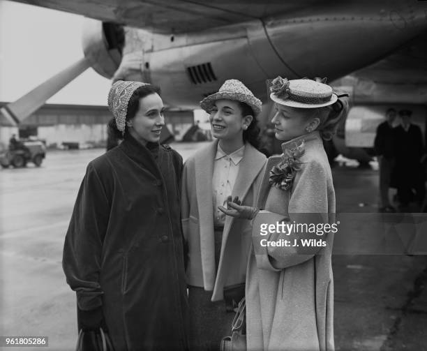 From left to right, Ruth Sobotka , Gloria Vauges and 16-year-old Barbara Bocher of the New York Ballet Company arrive at London Airport en route to...