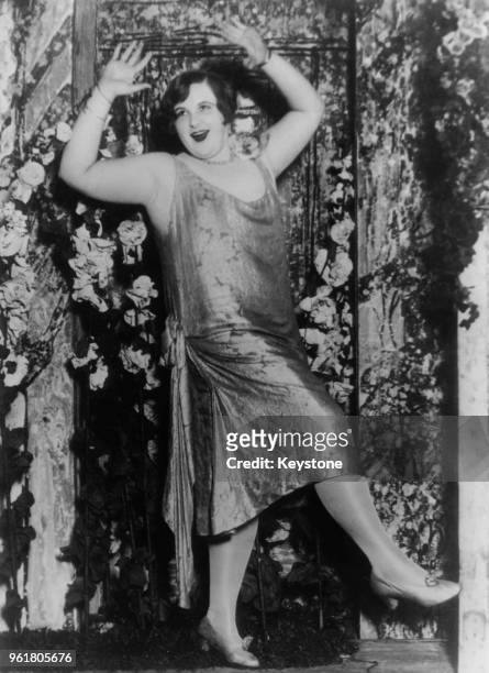 American singer Kate Smith dances the Charleston in Eddie Dowling's new revue 'Honeymoon Lane', 1926. She was discovered by Dowling singing and...