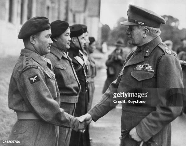 Field Marshal Sir William Slim of the British Army greets Lieutenant Ratanbahadur Pun of the 2nd Gurkhas, during a visit to the Dreghorn Barracks in...