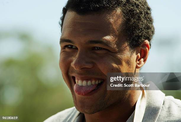 Jo-Wilfried Tsonga of France enjoys a barbecue on Australia Day during day nine of the 2010 Australian Open at Melbourne Park on January 26, 2010 in...