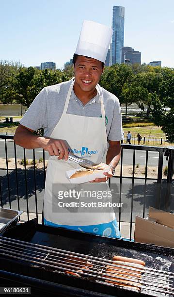 Jo-Wilfried Tsonga of France enjoys a barbecue on Australia Day during day nine of the 2010 Australian Open at Melbourne Park on January 26, 2010 in...