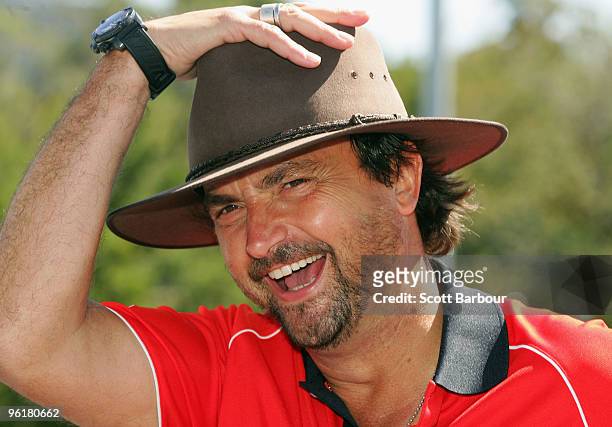 Henri Leconte of France enjoys a barbecue on Australia Day during day nine of the 2010 Australian Open at Melbourne Park on January 26, 2010 in...