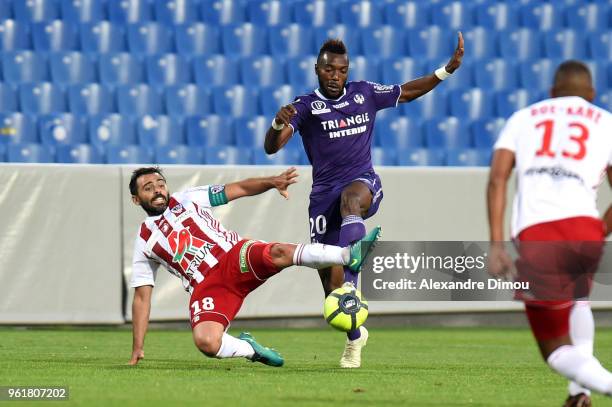 Steeve Yago of Toulouse and Johan Cavalli of Ajaccio during the Ligue 1 playoff match between AC Ajaccio and FC Toulouse at Stade de la Mosson on May...