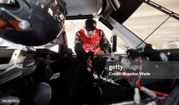 Driver David Gilliland inspects his car during the Speeding To Read event at Texas Motor Speedway on Wednesday, May 23, 2018 in Fort Worth, Texas.