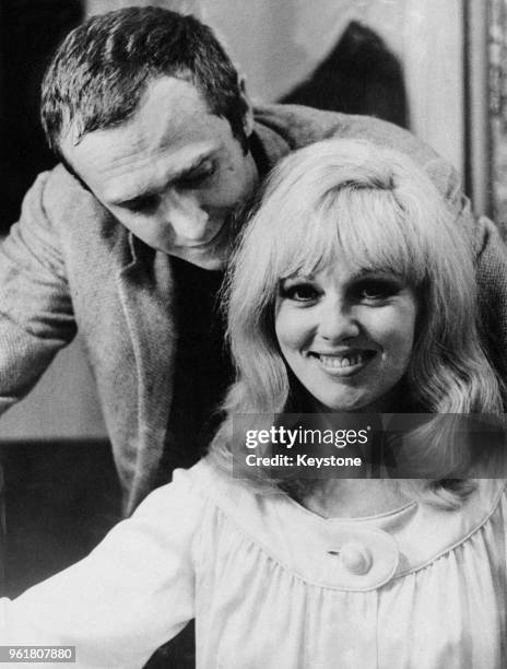 French actress Mylène Demongeot with her fiancé Marc Simenon in her dressing room at the Théâtre de la Michodière in Paris, France, where she is...