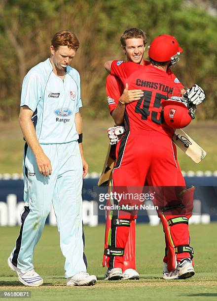 Gary Putland and Daniel Christian of the Redbacks embrace after winning the Ford Ranger Cup match between the Blues and the Redbacks at North Dalton...