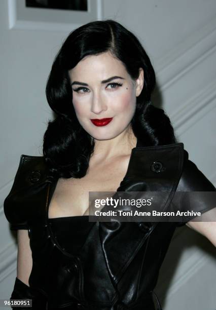 Dita Von Teese poses as she arrives at the Christian Dior Haute-Couture show as part of the Paris Fashion Week Spring/Summer 2010 on January 25, 2010...