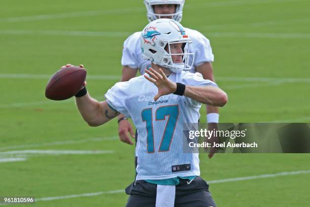 Ryan Tannehill of the Miami Dolphins throws the ball during the teams training camp on May 23, 2018 at the Miami Dolphins training facility in Davie,...