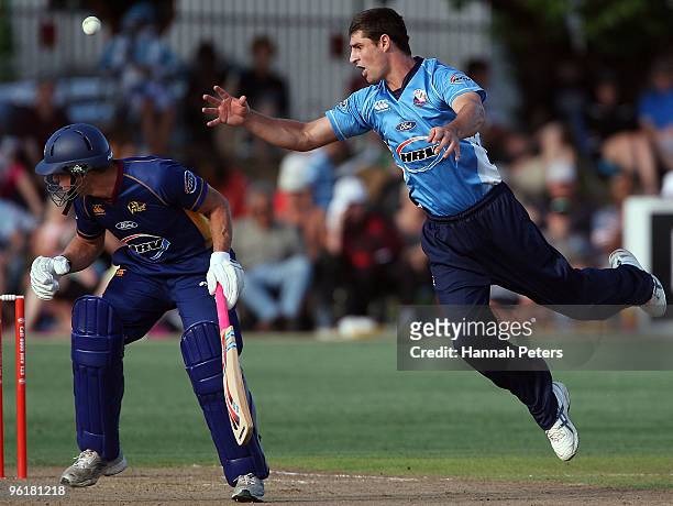 Colin de Grandhomme of Auckland fields off his own bowling during the HRV Cup Twenty20 match between the Auckland Aces and the Otago Volts at Colin...