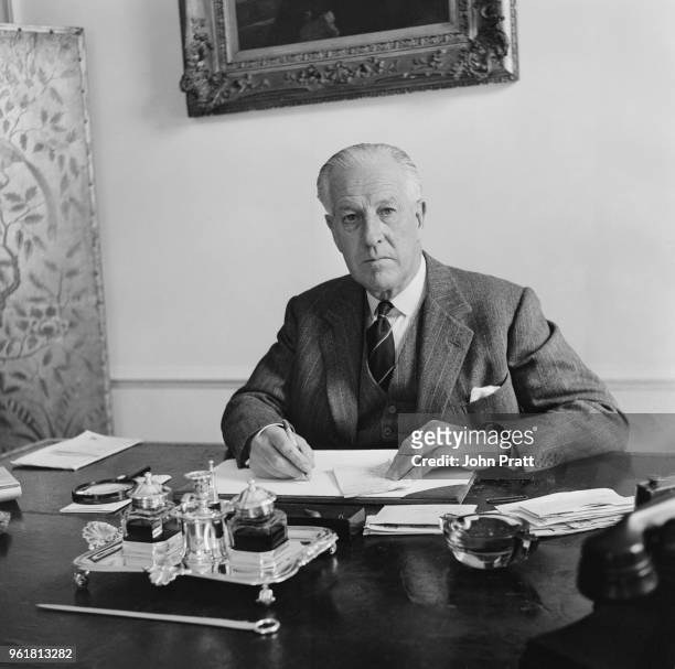 Admiral Sir Gresham Nicholson, KBE, CB, DSO, DSC , formerly of the Royal Navy and now Lieutenant-Governor of Jersey, in his office at Government...