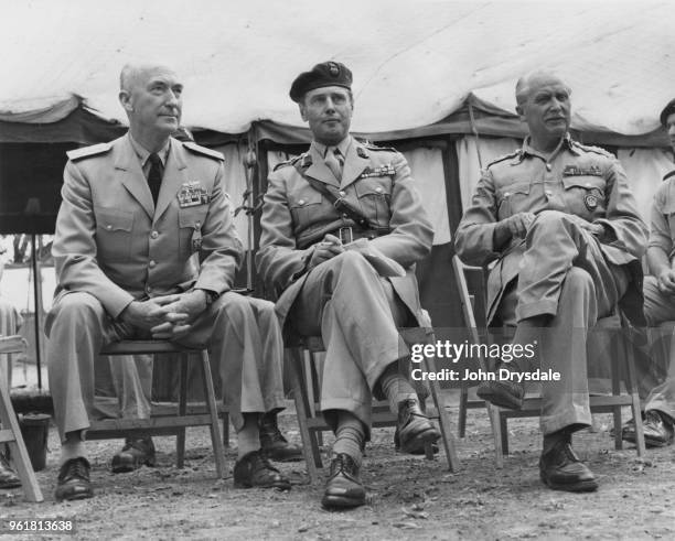 From left to right, Admiral James Sargent Russell of the US Navy, Brigadier Michael Forrester of the British Army, and General Sir Hugh Stockwell of...