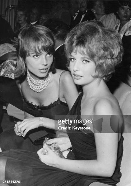 Italian actress Elsa Martinelli and Danish actress Annette Stroyberg at the premiere of the film 'Et Mourir de Plaisir' on the Champs-Élysées in...