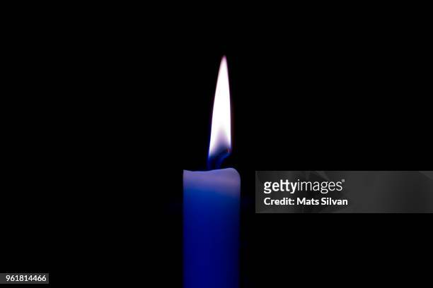 candle light - blue candle stock-fotos und bilder