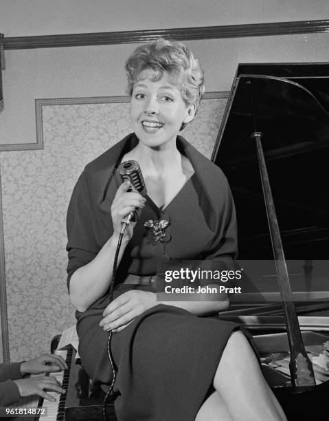 English singer Rosemary Squires rehearses at the Moss household in Golders Green, London, February 1958.