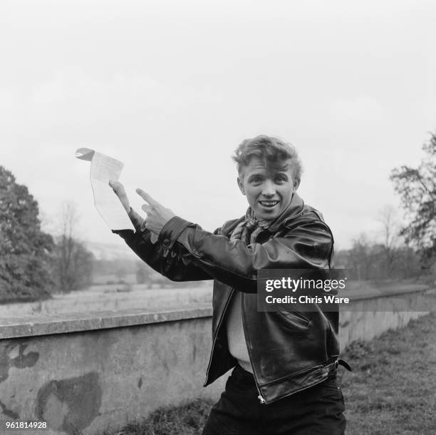 English entertainer Tommy Steele during the filming of 'The Duke Wore Jeans' in Buckinghamshire, 17th November 1957. He is clearly thrilled to be on...