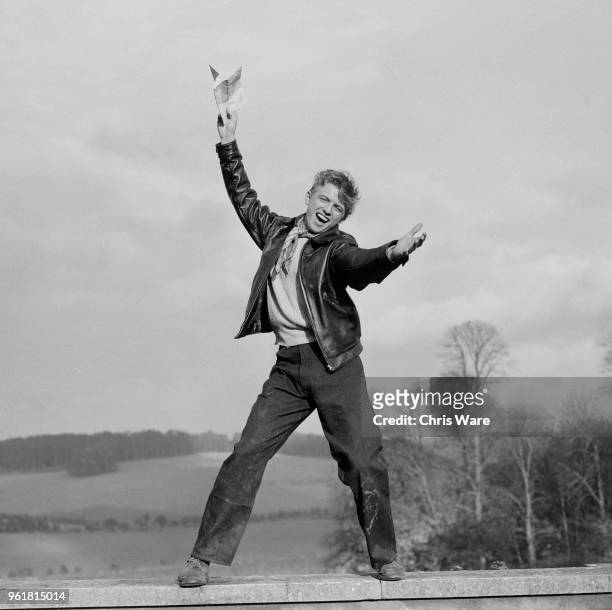 English entertainer Tommy Steele during the filming of 'The Duke Wore Jeans' in Buckinghamshire, 17th November 1957. He is clearly thrilled to be on...