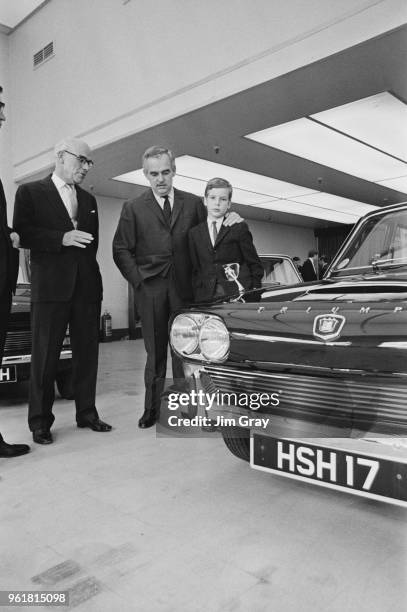 English industrialist Donald Stokes, Baron Stokes , chairman of British Leyland, personally greets Prince Rainier III of Monaco and his son Prince...