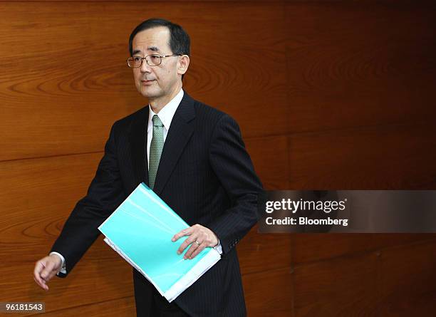 Masaaki Shirakawa, governor of the Bank of Japan, arrives for a news conference at the central bank's headquarters in Tokyo, Japan, on Tuesday, Jan....