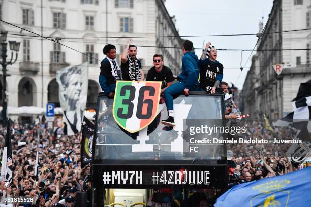 Juan Cuadrado , Mattia De Sciglio , Daniele Rugani and Federico Bernardeschi of Juventus cheers the fans during a victory Parade by Juventus on May...