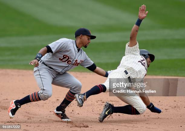Dixon Machado of the Detroit Tigers tags out Eddie Rosario of the Minnesota Twins after a rundown during the sixth inning of the game on May 23, 2018...