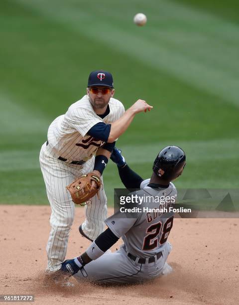 Niko Goodrum of the Detroit Tigers is out at second base as Brian Dozier of the Minnesota Twins turns a double play during the sixth inning of the...