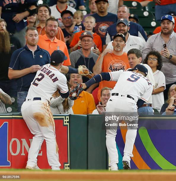 Marwin Gonzalez of the Houston Astros makes a catch in foul territory on a fly ball by Brandon Belt of the San Francisco Giants in the sixth inning...