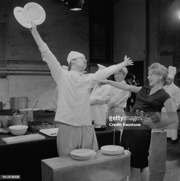 Actors Robert Stephens as a cook and Mary Peach as waitress Monique during rehearsals for the play 'The Kitchen' by Arnold Wesker at the Royal Court...