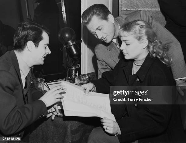 From left to right, French actors Serge Reggiani , Claude Dauphin and Simone Signoret dub the French film 'Casque d'Or' into English at the RCA...