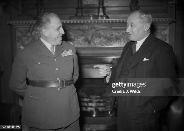 British Labour politician Manny Shinwell , the Secretary of State for War, chats with General Georges Revers , Chief of the General Staff of the...