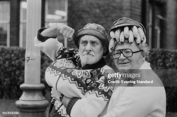 British comedians Spike Milligan and Harry Secombe of the 'The Goon Show' mess about with a bunch of bananas, 24th April 1978.