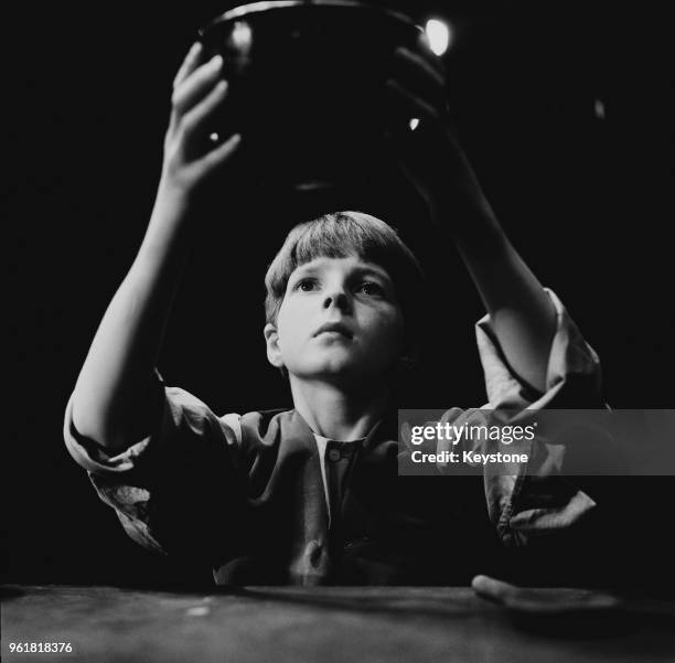 English child actor Martin Stephens asks for more during a rehearsal for Lionel Bart's musical 'Oliver!', 4th August 1961. Stephens, who plays...