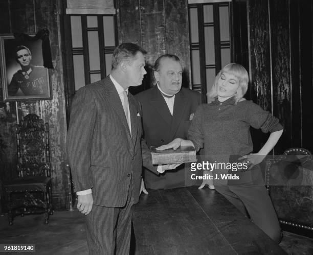 From left to right, actors Nigel Stock as Werner, Basil Sydney as the Father and Diane Cilento as Leni during rehearsals for the play 'Altona', based...