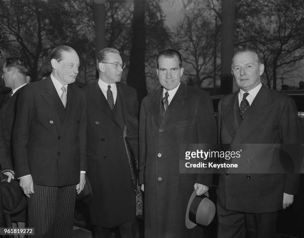 Vice President Richard Nixon arrives at the Savoy Hotel in London as the guest of honour at the Pilgrims' Luncheon, 25th November 1958. From left to...
