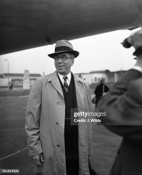 Admiral Lewis Strauss , chairman of the United States Atomic Energy Commission, arrives at London Airport for a tour of British atomic energy plants,...