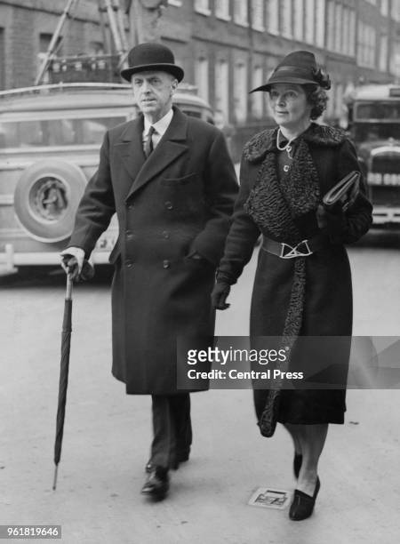 British military officer Sir Frederick Sykes and Lady Isabel Sykes attend the wedding of Randolph Churchill and Pamela Digby at St John's in...