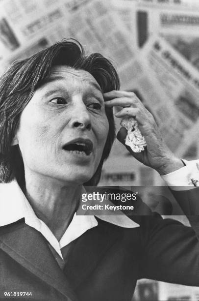 Chinese-born physician and writer Han Suyin holds a press conference in Belgium on the situation in China, 1977.