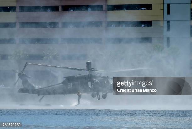 Special operators jump from a Black Hawk UH-60 helicopter into Tampa Bay as they participate in an International Special Operations Forces...
