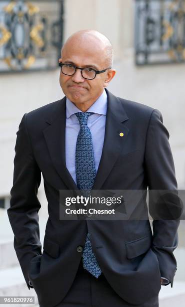 Microsoft CEO Satya Nadella leaves the Elysee Presidential Palace after a meeting with French President Emmanuel Macron on May 23, 2018 in Paris,...