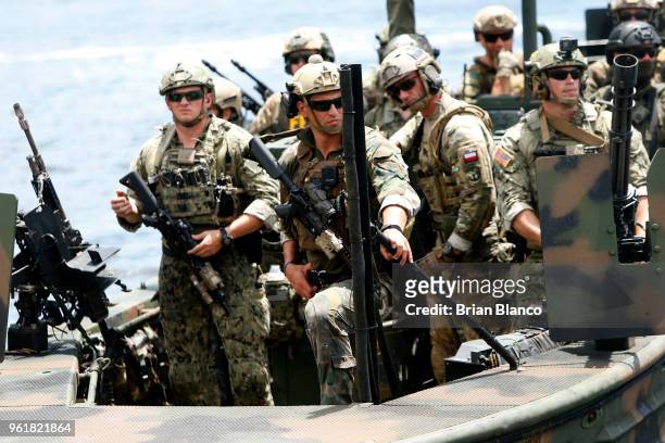 Special operators return to the shore in a Special Operations Craft - Riverine after participating in an International Special Operations Forces...