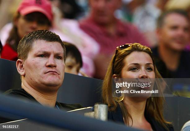 Boxer Ricky Hatton and his fiancee Jennifer Dooley watch the quarterfinal match between Rafael Nadal of Spain and Andy Murray of Great Britain during...
