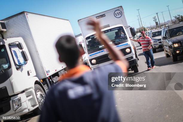 Truck drivers gather on BR 040 highway during a protest against rising fuel prices in Luziania, Brazil, on Wednesday, May 23, 2018. Brazilian...