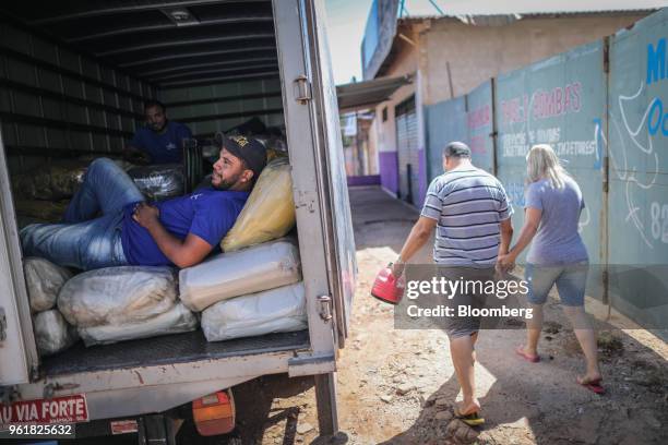 Drivers sit inside a truck while parked on BR 040 highway during a protest against rising fuel prices in Luziania, Brazil, on Wednesday, May 23,...