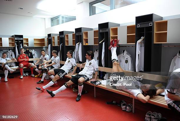Bastian Schweinsteiger, Manuel Neuer, Mesut Oezil, Philipp Lahm, Miroslav Klose and Sedar Tasci of Germany relax in the dressing room during a record...