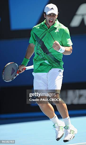 Fernando Verdasco of Spain celebrates winning a point against Nikolay Davydenko of Russia in their men's singles fourth round match on day eight of...