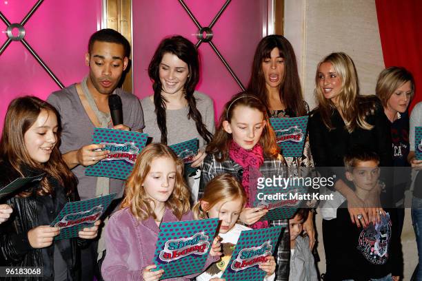 Back row Danyl Johnson, Lucie Jones, Lisa Barbuscia and Louise Redknapp attend the Celebrity Christmas Sing-a-long at Selfridges on December 8, 2009...