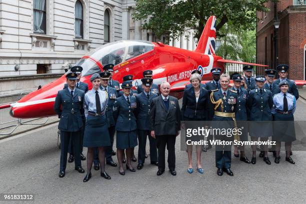 British Prime Minister Theresa May , WW2 pilot Colin Bell and Air Chief Marshal Stephen Hillier pose for a photo with a group of RAF personnel next...