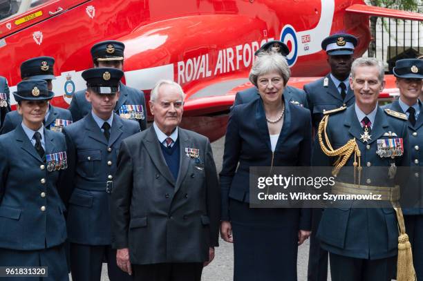 British Prime Minister Theresa May , WW2 pilot Colin Bell and Air Chief Marshal Stephen Hillier pose for a photo with a group of RAF personnel next...