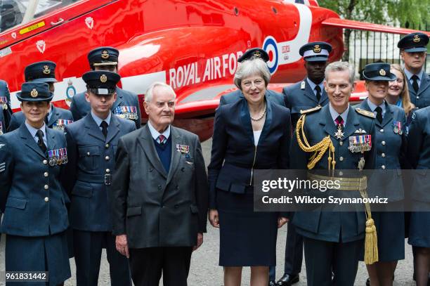 British Prime Minister Theresa May , WW2 pilot Colin Bell and Air Chief Marshal Stephen Hillier pose for a photo with a group of RAF personnel next...